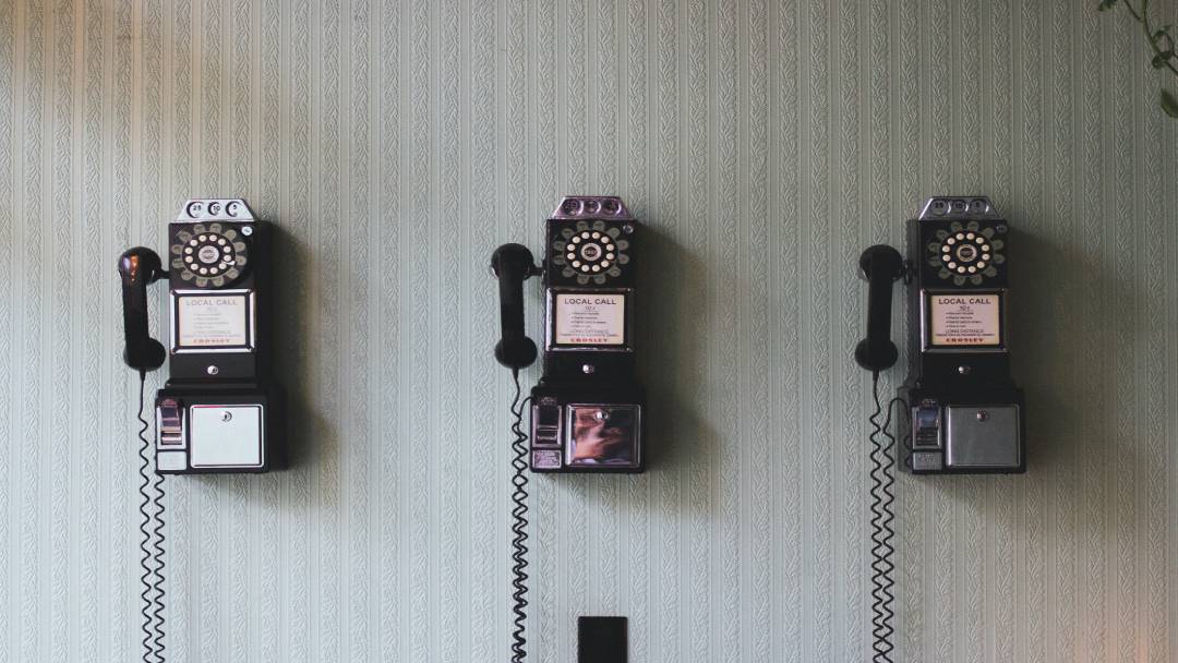 Old rotary phones hanging on the wall