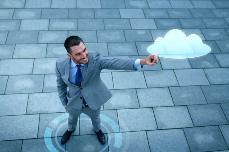 business-development-technology-people-concept-young-smiling-businessman-pointing-finger-cloud-projection-outdoors-from-top