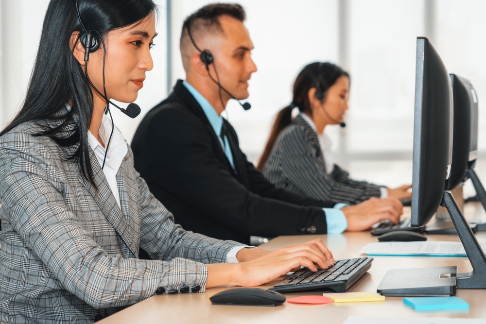 SE Telecom VoIP Toronto team on headsets managing cloud communication deployments for GTA organizations in a modern Toronto office