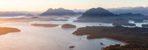 A panoramic view of Vancouver Island’s coastline at sunrise, representing local organizations adopting hosted VoIP in Vancouver Island for secure Canadian-based communication.