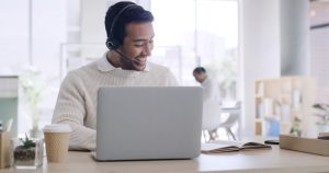 Enterprise customer service professional using cloud VoIP phone system highlighting VoIP vs traditional phone systems for enterprises