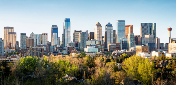 Aerial view of Calgary skyline and Bow River representing modern business VoiP Calgary telecom infrastructure supporting businesses in Canada