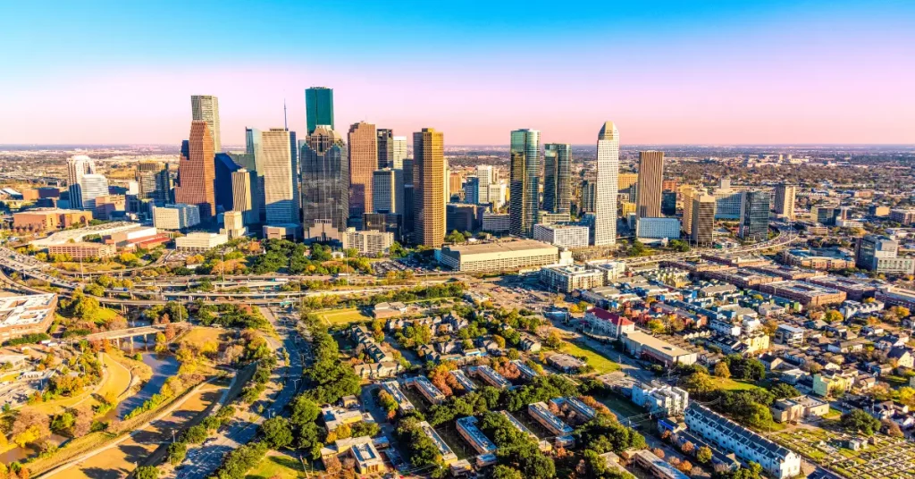 Aerial view of downtown Houston Texas skyline where businesses partner with UCaaS and VoIP service providers Houston Texas for modern cloud communication systems