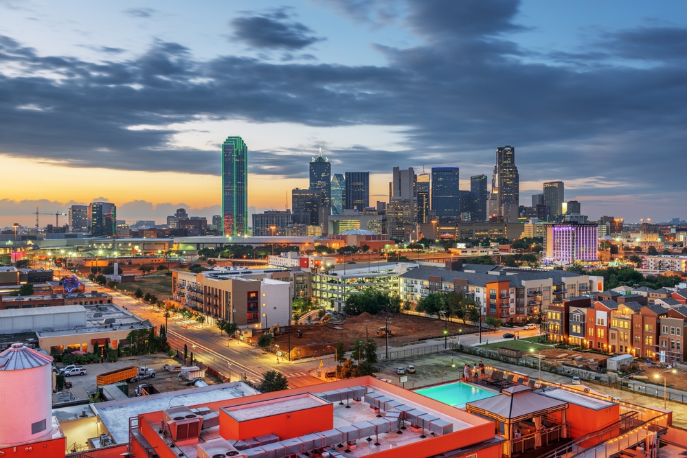 Downtown Dallas skyline at sunset with commercial buildings and offices across the city where many businesses use voip texas communication systems