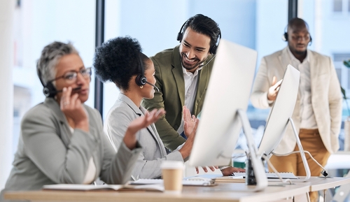 Toronto business professional on a cloud phone system at her desk with SE Telecom UCaaS platform in use