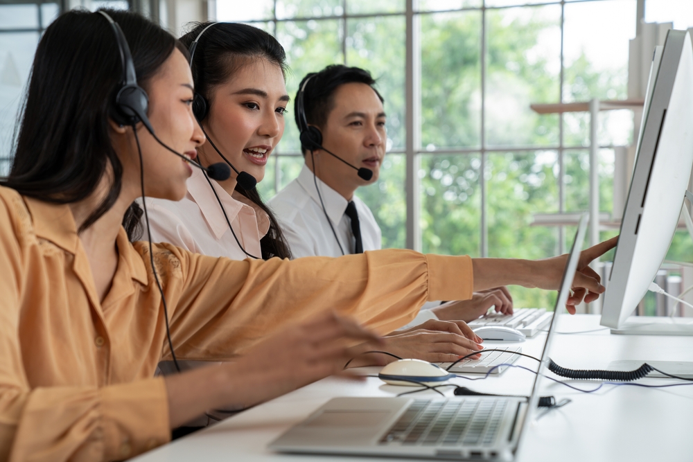 SE Telecom team demonstrating can Microsoft Teams be used as a phone system using the Clear Clouds plugin in a modern Canadian office