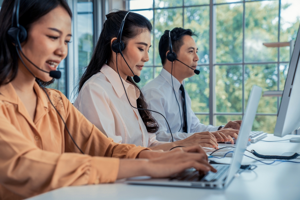 Canadian business professionals on headsets exploring can Microsoft Teams be used as a phone system through SE Telecom's Direct Routing solution