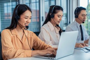 SE Telecom Canadian organization professional smiling while using can Microsoft Teams be used as a phone system solution through Clear Clouds