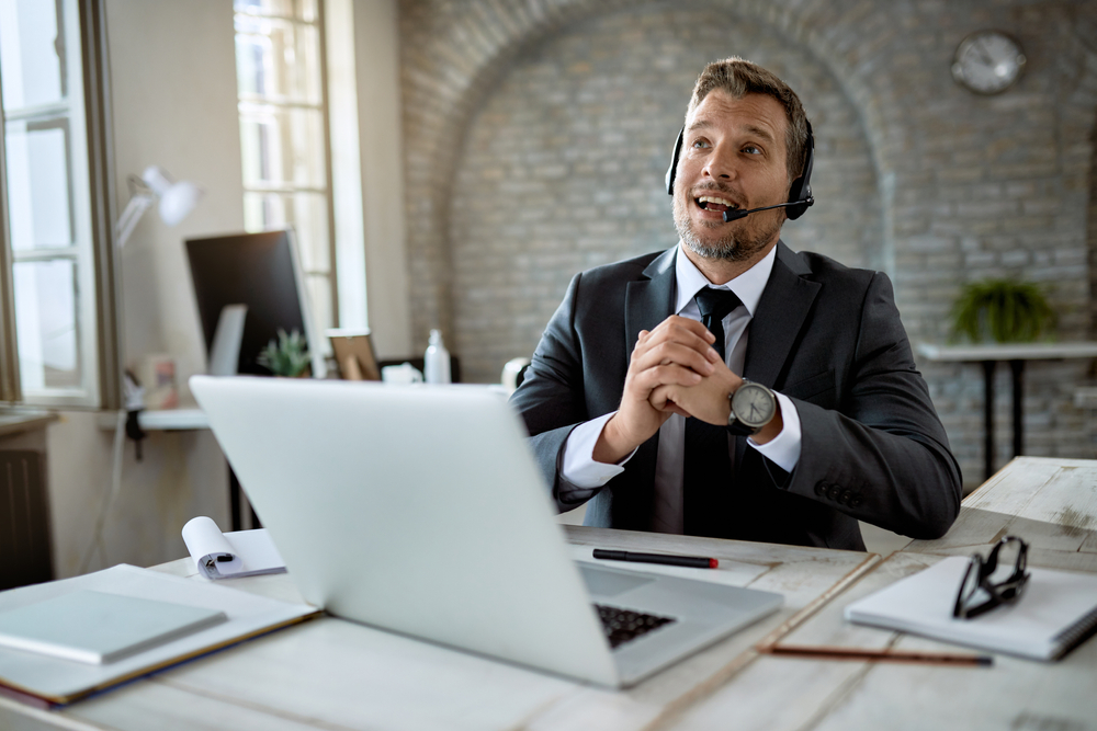 Canadian operations leader on SE Telecom telecommunications Canada VoIP headset discussing business phone system modernization in corporate office