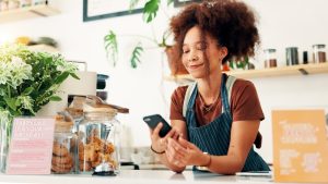 Coffee shop owner on phone