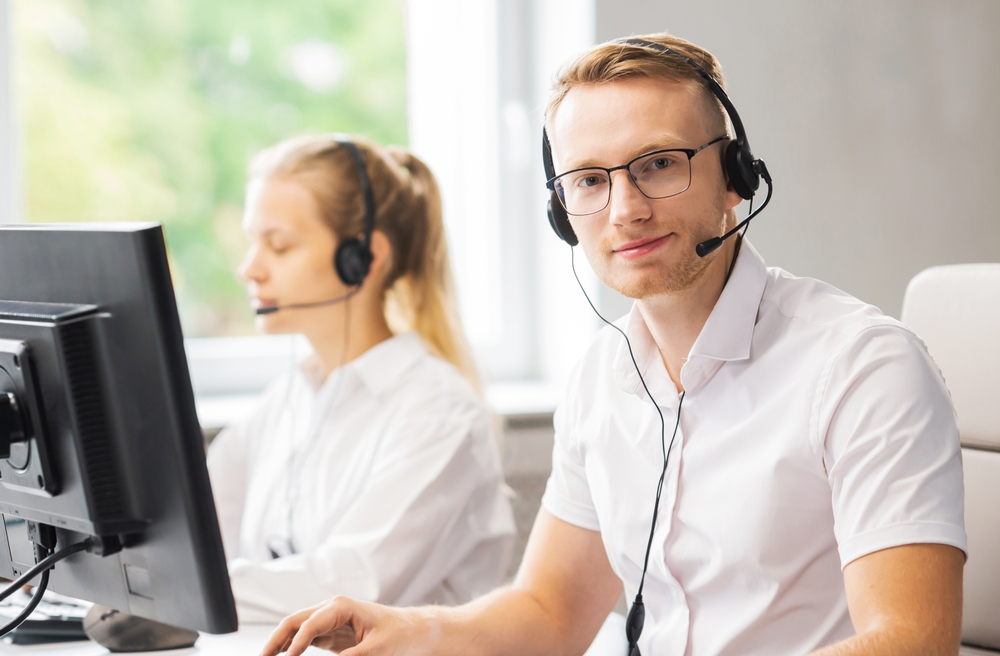Call center support agent talking on a headset