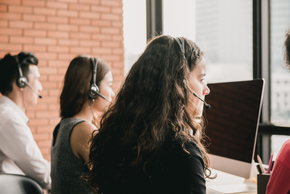 Team of telemarketing professionals in a call center