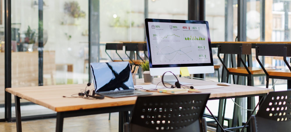 Modern business desk featuring an IP phone and headset representing VoIP Halifax communication systems for professional offices.
