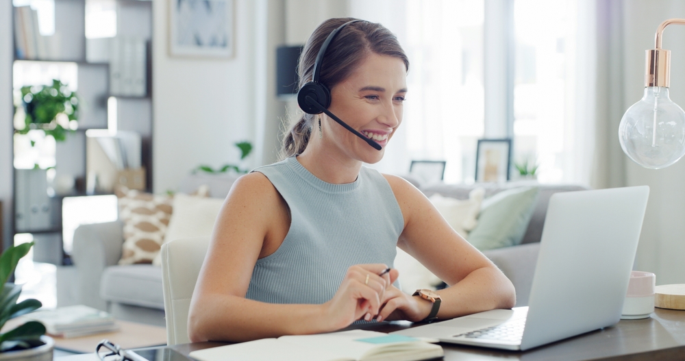Support representative managing customer inquiries on a headset using solutions from quebec voip providers.