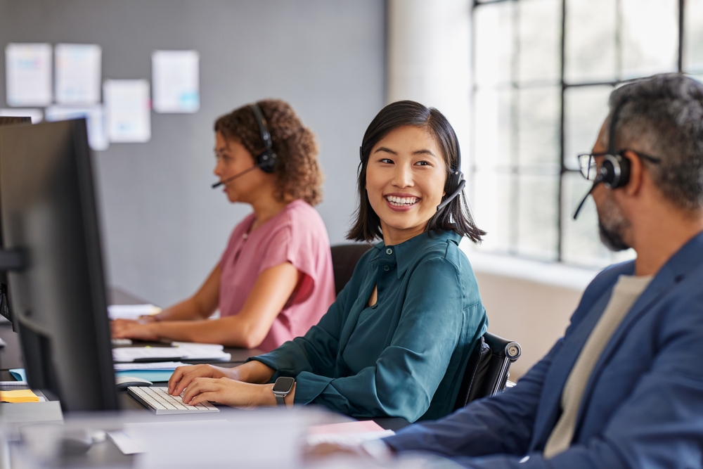 Business professional wearing a headset while speaking with one of several VoIP service providers