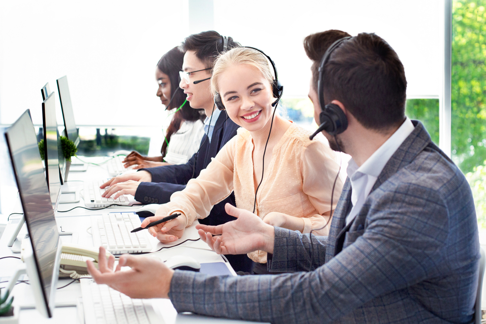 Contact center agent wearing a headset while working with a cloud VoIP service provider