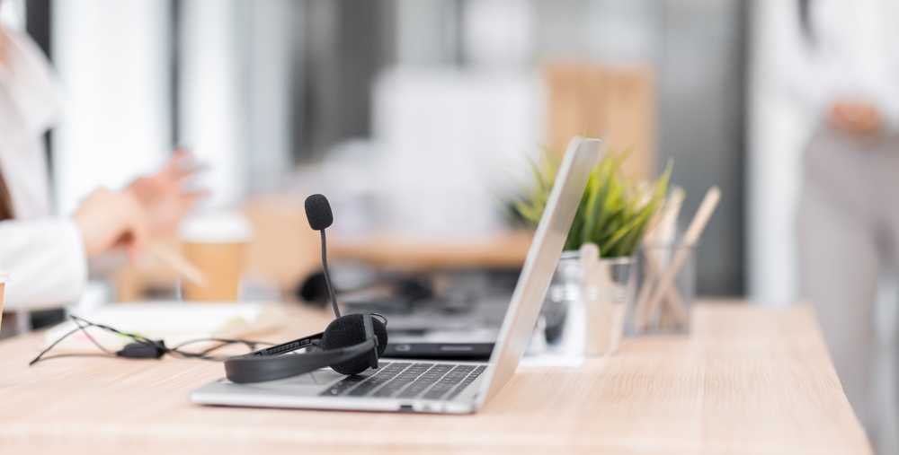 Business professional managing calls through VoIP phone systems for business