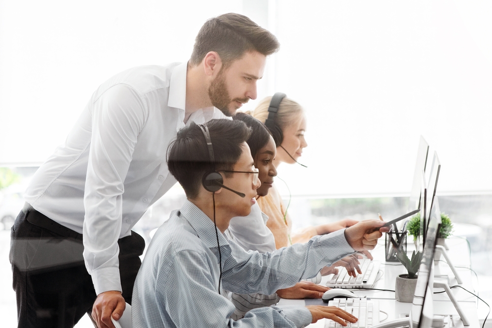 Customer service professional using VoIP phone systems for business with a headset