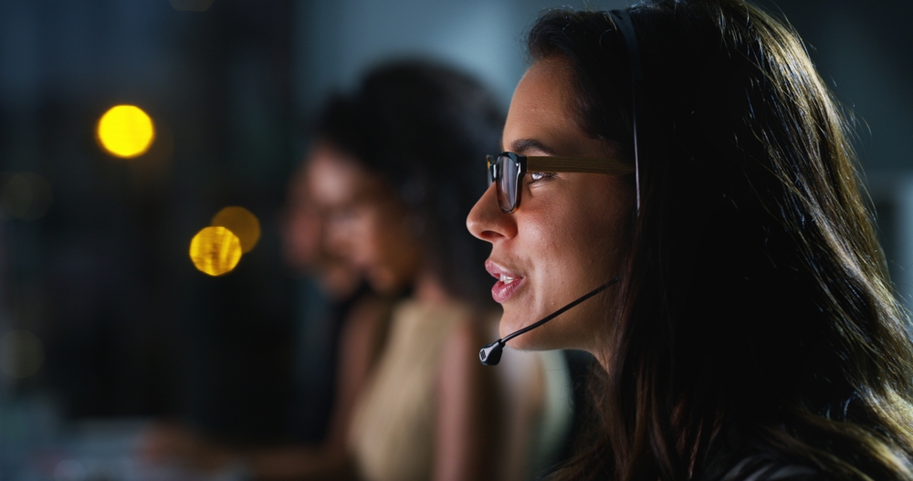 Corporate team member collaborating with customers over a headset using voip phone Vancouver to improve business communication and productivity.
