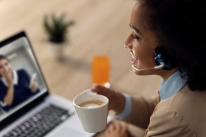 Professional wearing a headset while managing business calls with VoIP Solutions for Business in Niagara Falls.