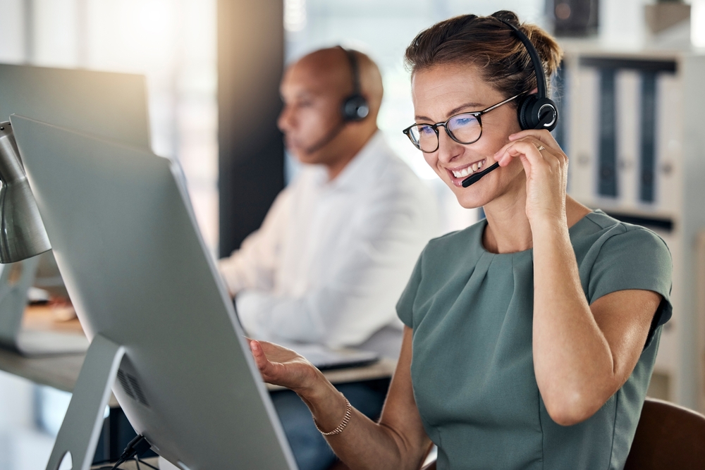 Customer,Service,,Call,Center,And,Crm,With,A,Woman,Consultant IT professional testing a cloud communications platform setup while wearing a headset