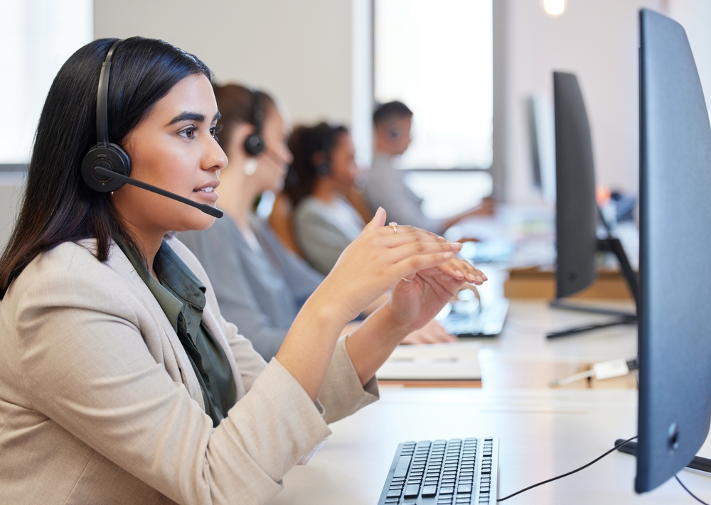 Customer service agent wearing a headset, with every call carried by managed network services