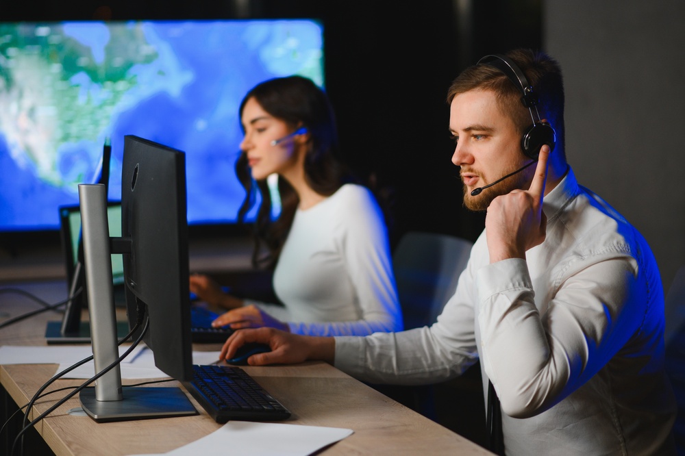 Professional on a headset call at a multi-site organization using managed network services in Canada