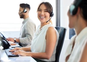 Professional wearing a headset while discussing unified communications solutions during a work call