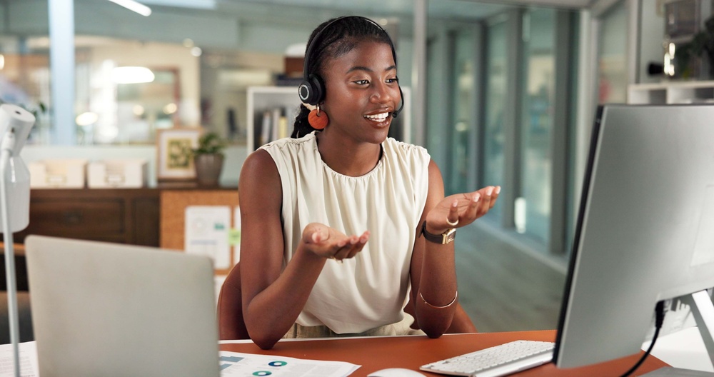 Smiling professional in a headset on a call, supported by SE Telecom business phone service in Canada
